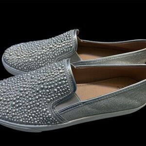 New without tags; size 9M women’s silver slip on shoes